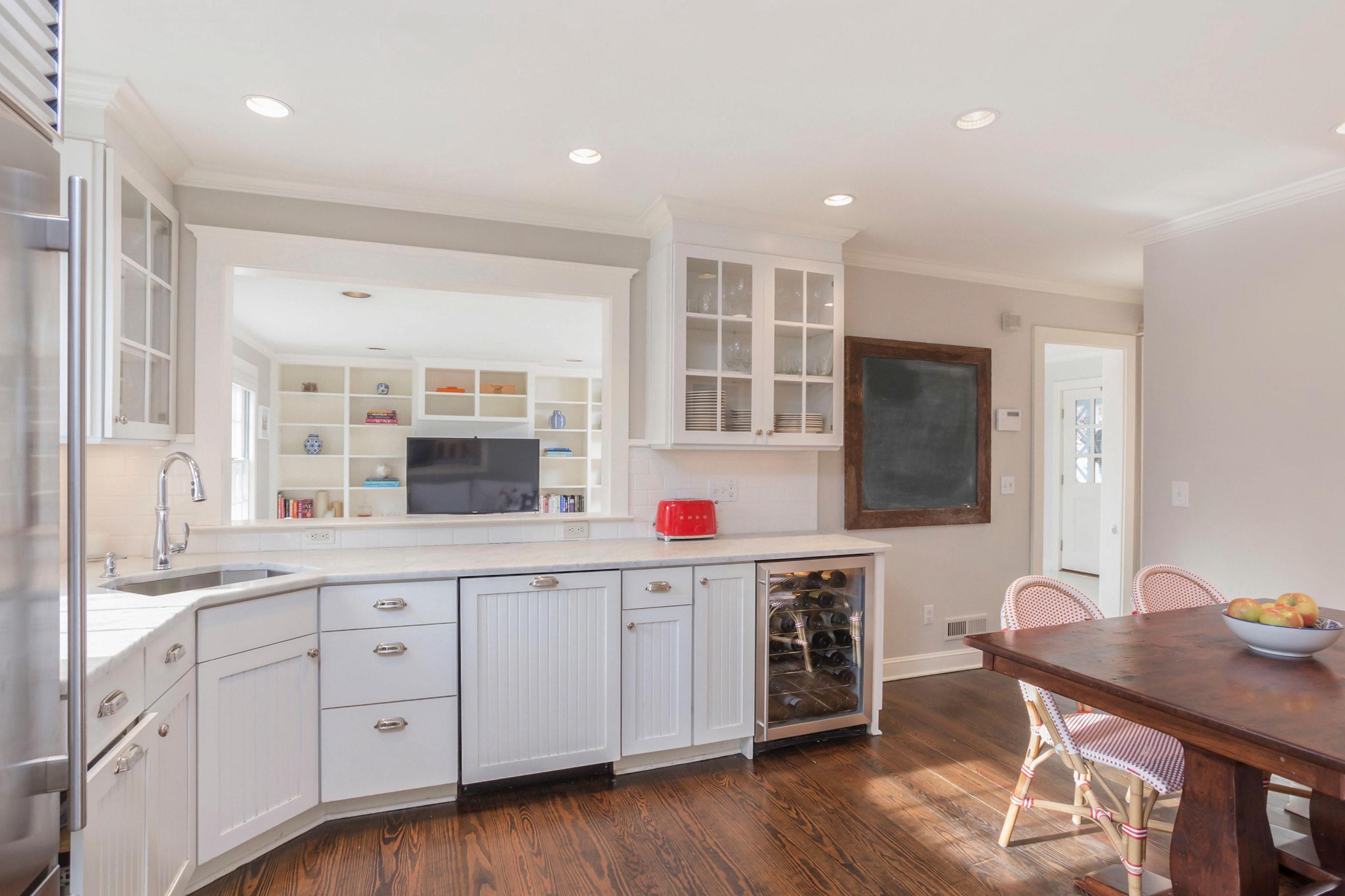 204 Middlesex Road Darien, CT 06820 - Photo 9 of 23 a kitchen with a sink cabinets and wooden floor