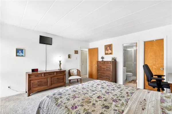 a bedroom with a bed and furniture