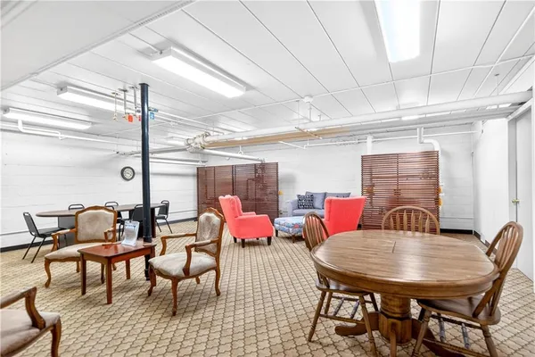 a dining room with furniture and window