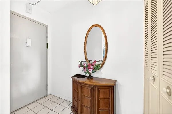 a view of a hallway with a chandelier