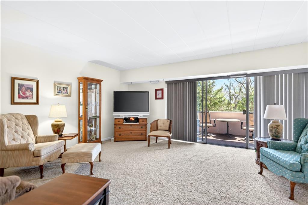 55 Highland Road, Unit 503 Bethel Park, PA 15102 - Photo 7 of 32 Living room with sliding doors onto patio