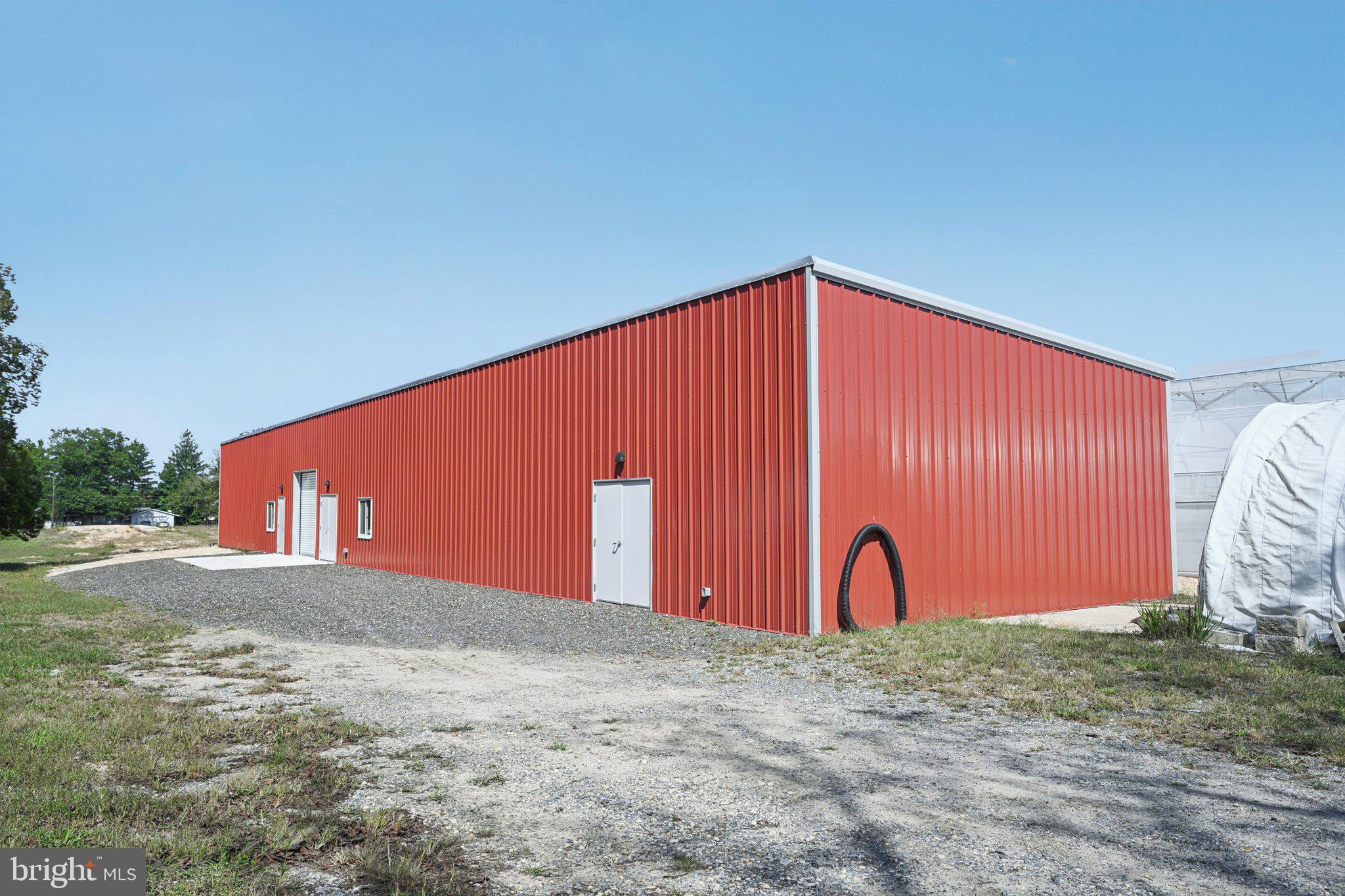 1001 South West Avenue Vineland, NJ 08360 - Photo 11 of 61 a blue sign that is sitting in front of a house