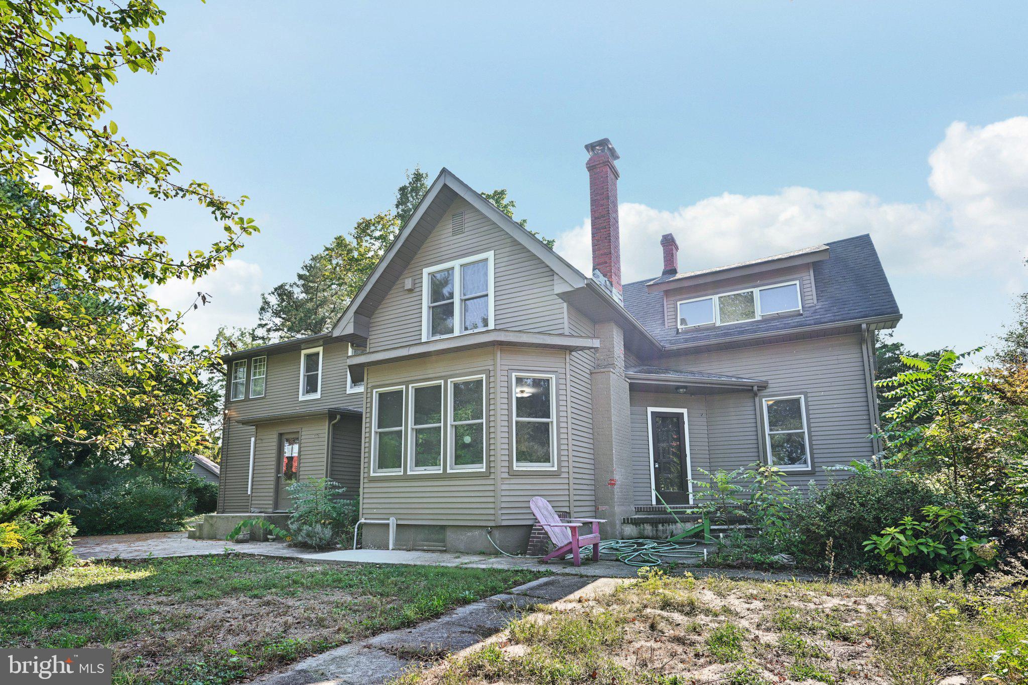 1001 South West Avenue Vineland, NJ 08360 - Photo 23 of 61 a front view of a house with garden