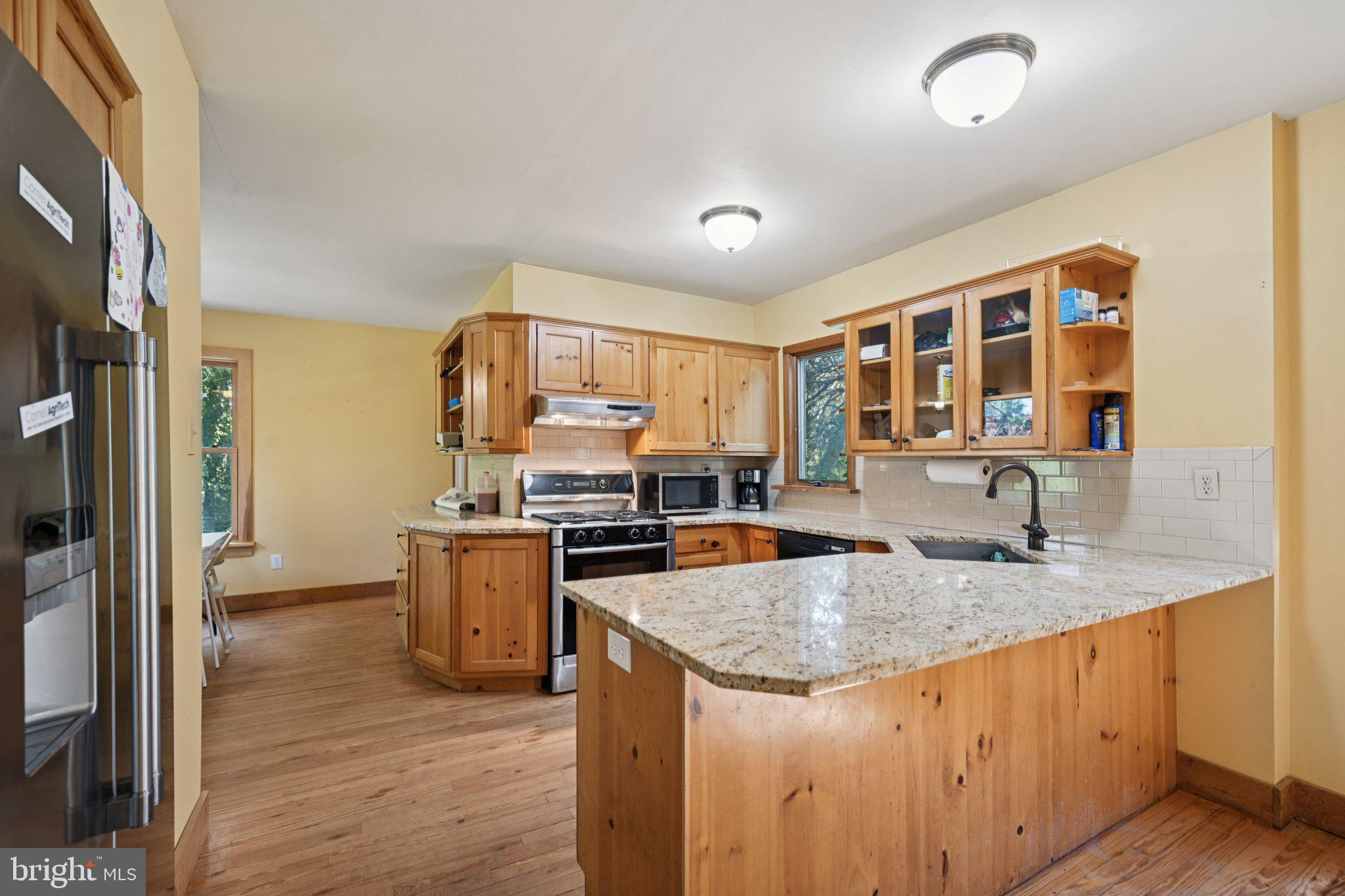 1001 South West Avenue Vineland, NJ 08360 - Photo 28 of 61 a kitchen with a stove a sink and a refrigerator
