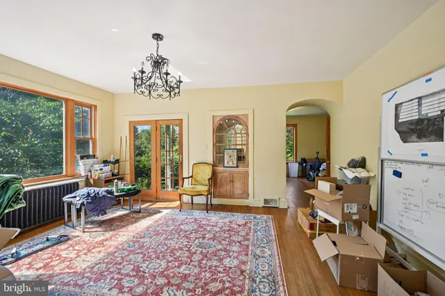 a view of a room with wooden floor and window