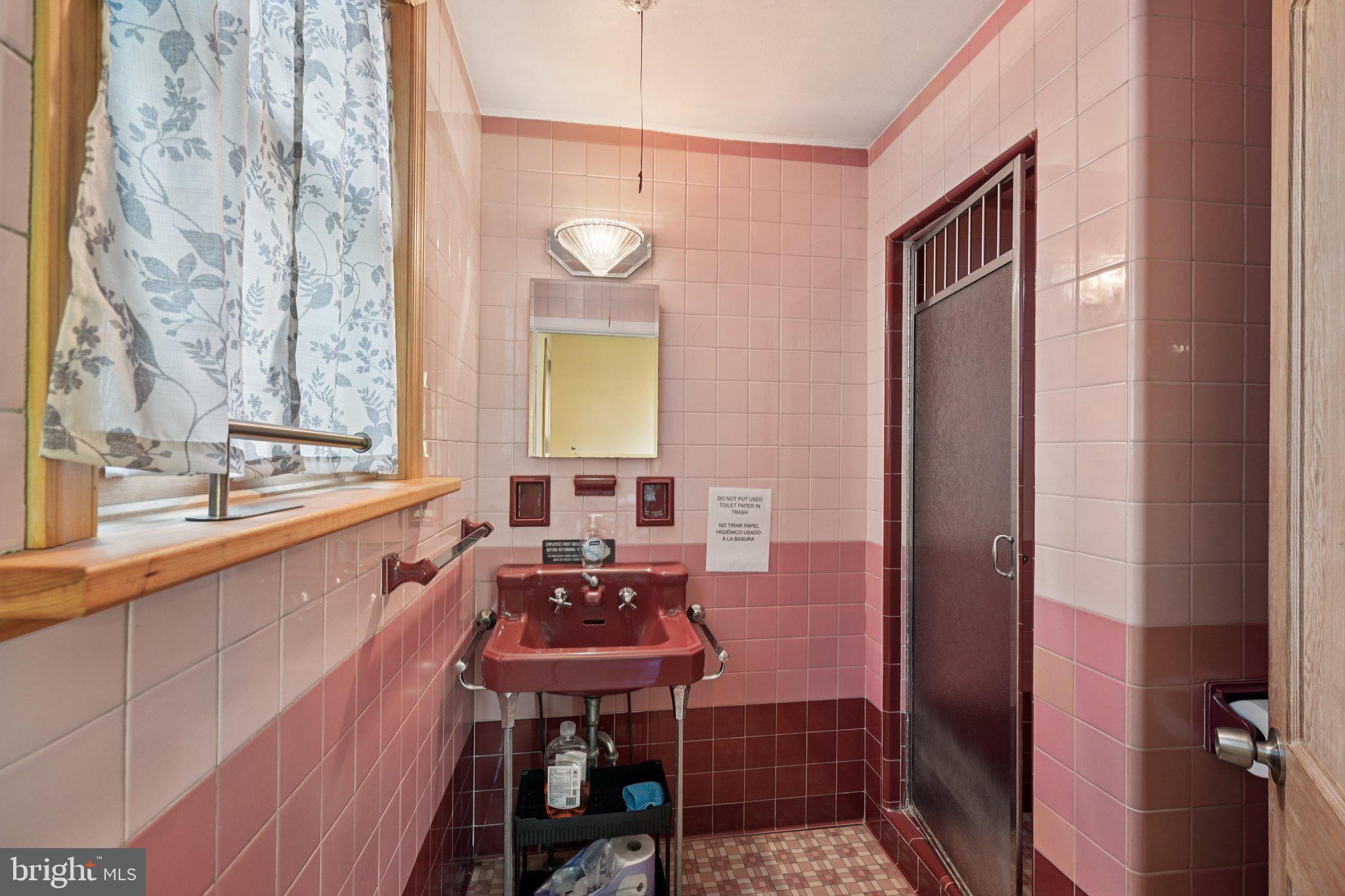 1001 South West Avenue Vineland, NJ 08360 - Photo 38 of 61 a bathroom with a sink a mirror and a bathtub