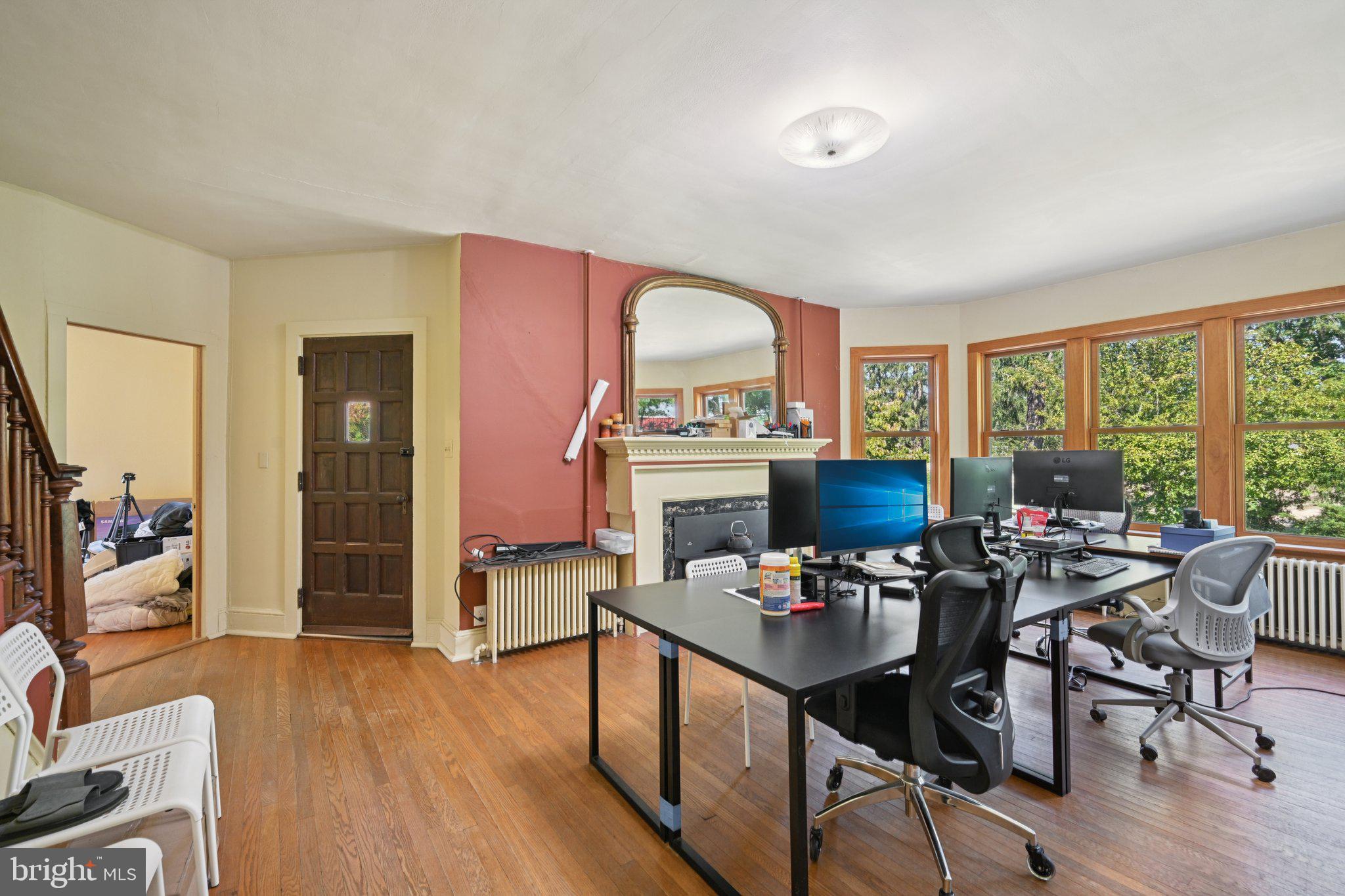 1001 South West Avenue Vineland, NJ 08360 - Photo 40 of 61 a view of a workspace with furniture and a large window