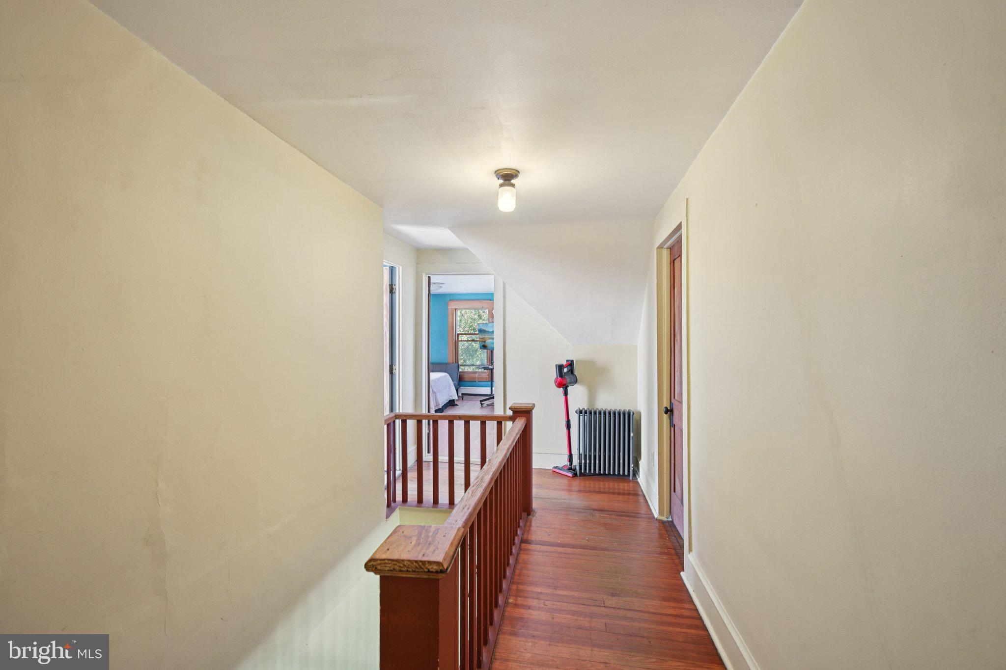 1001 South West Avenue Vineland, NJ 08360 - Photo 48 of 61 a view of a hallway with wooden floor and windows
