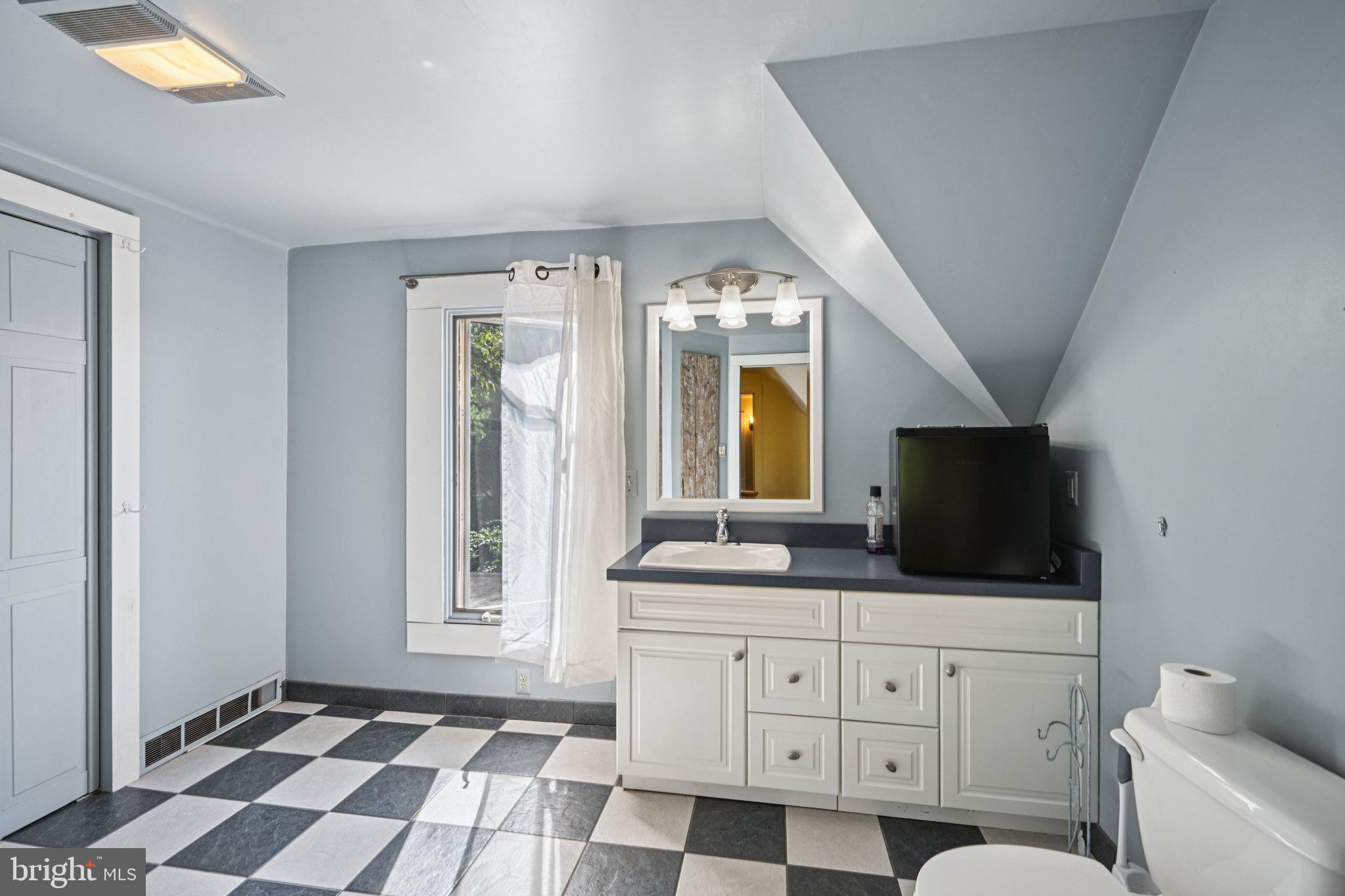 1001 South West Avenue Vineland, NJ 08360 - Photo 49 of 61 a spacious bathroom with a granite countertop sink and a mirror