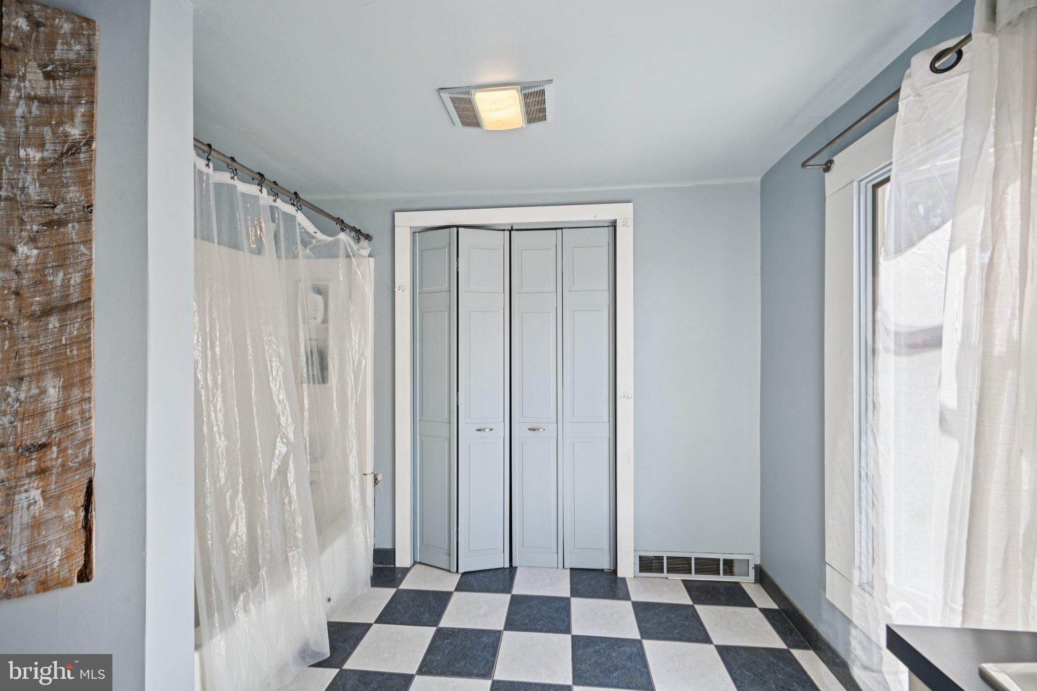 1001 South West Avenue Vineland, NJ 08360 - Photo 51 of 61 a view of a bathroom with a black and white checkered floor