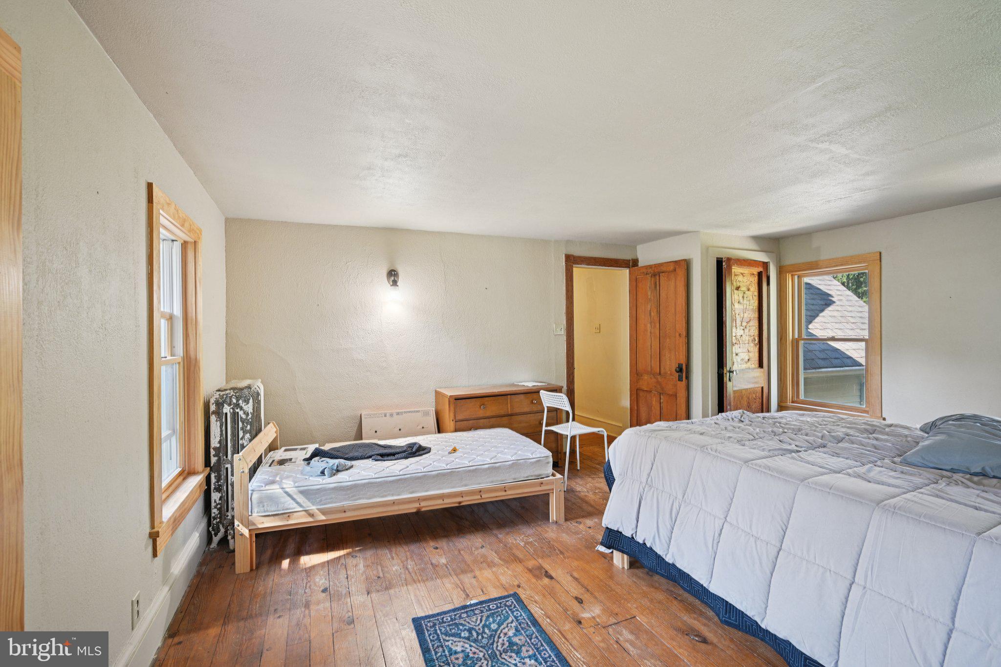 1001 South West Avenue Vineland, NJ 08360 - Photo 54 of 61 a bedroom with a bed and wooden floor