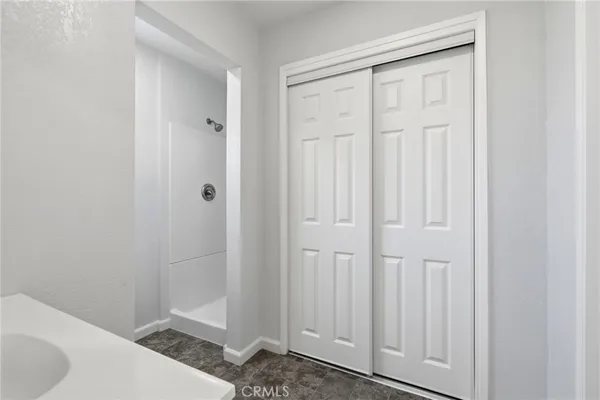 a bathroom with a sink a vanity and a mirror
