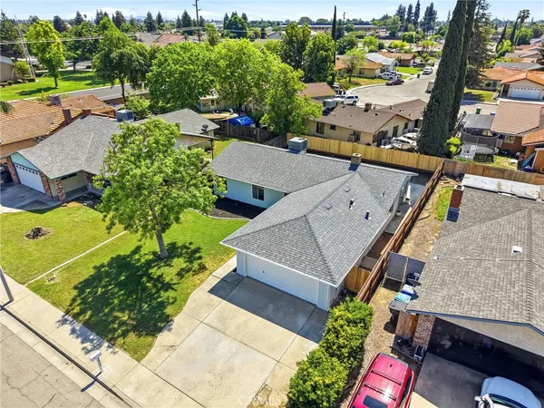 an aerial view of a house with a garden