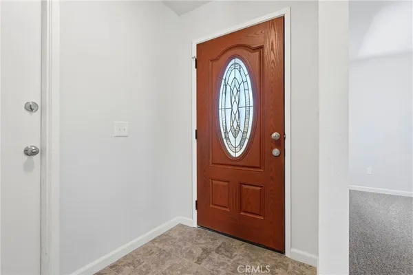 a view of a hallway with washer and dryer