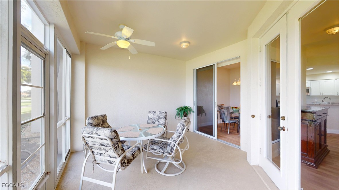 9130 Bayberry Bend, Unit 102 Fort Myers, FL 33908 - Photo 16 of 44 a view of a dining room with furniture and a chandelier