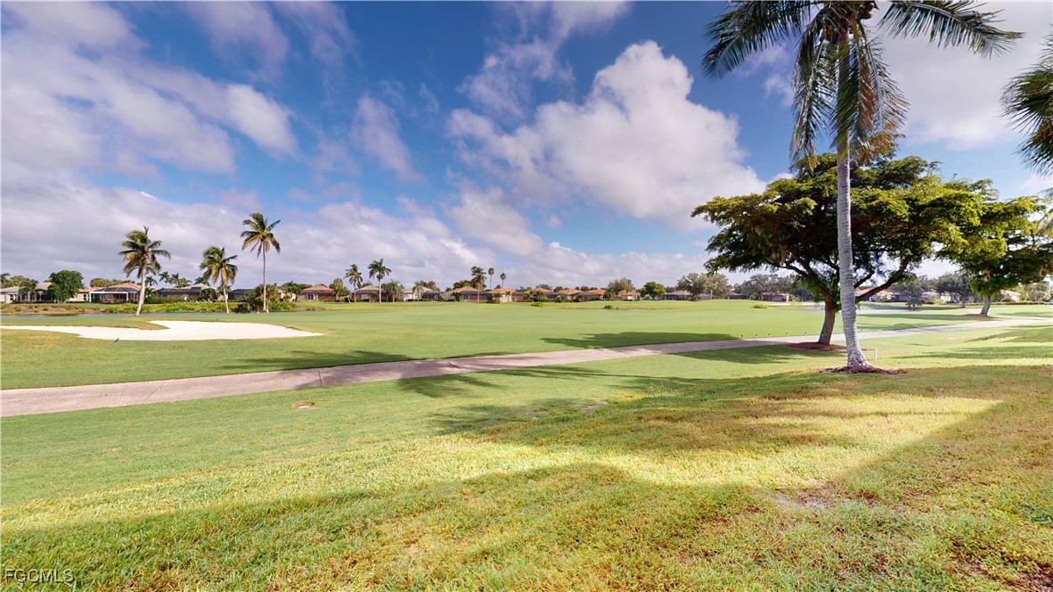 9130 Bayberry Bend, Unit 102 Fort Myers, FL 33908 - Photo 18 of 44 a view of a swimming pool and an ocean view