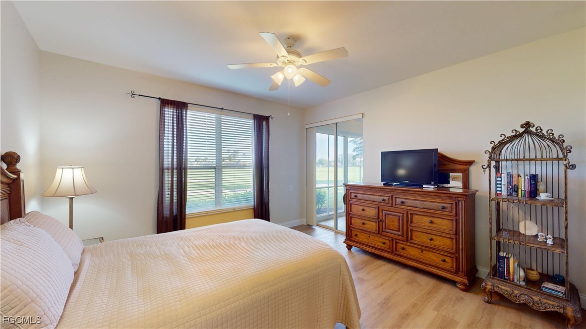 9130 Bayberry Bend, Unit 102 Fort Myers, FL 33908 - Photo 20 of 44 a bedroom with a bed and a flat screen tv