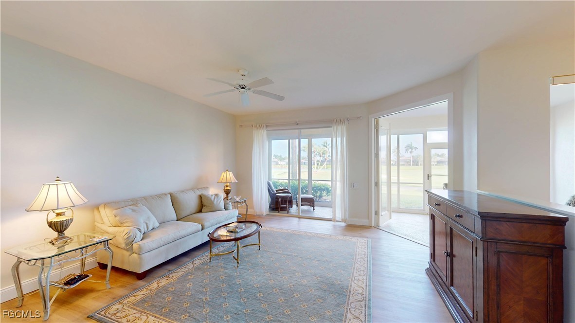 9130 Bayberry Bend, Unit 102 Fort Myers, FL 33908 - Photo 2 of 44 a living room with furniture and a large window