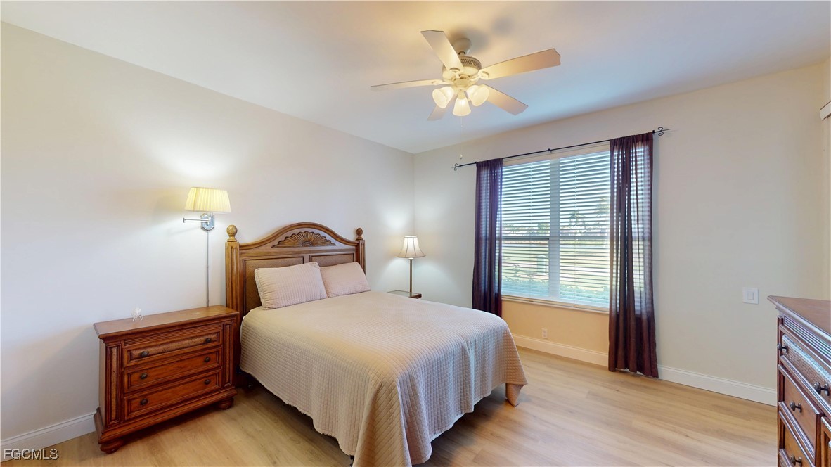 9130 Bayberry Bend, Unit 102 Fort Myers, FL 33908 - Photo 21 of 44 a bedroom with a bed and a window