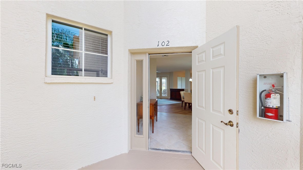 9130 Bayberry Bend, Unit 102 Fort Myers, FL 33908 - Photo 31 of 44 a view of a hallway with wooden floor and entryway