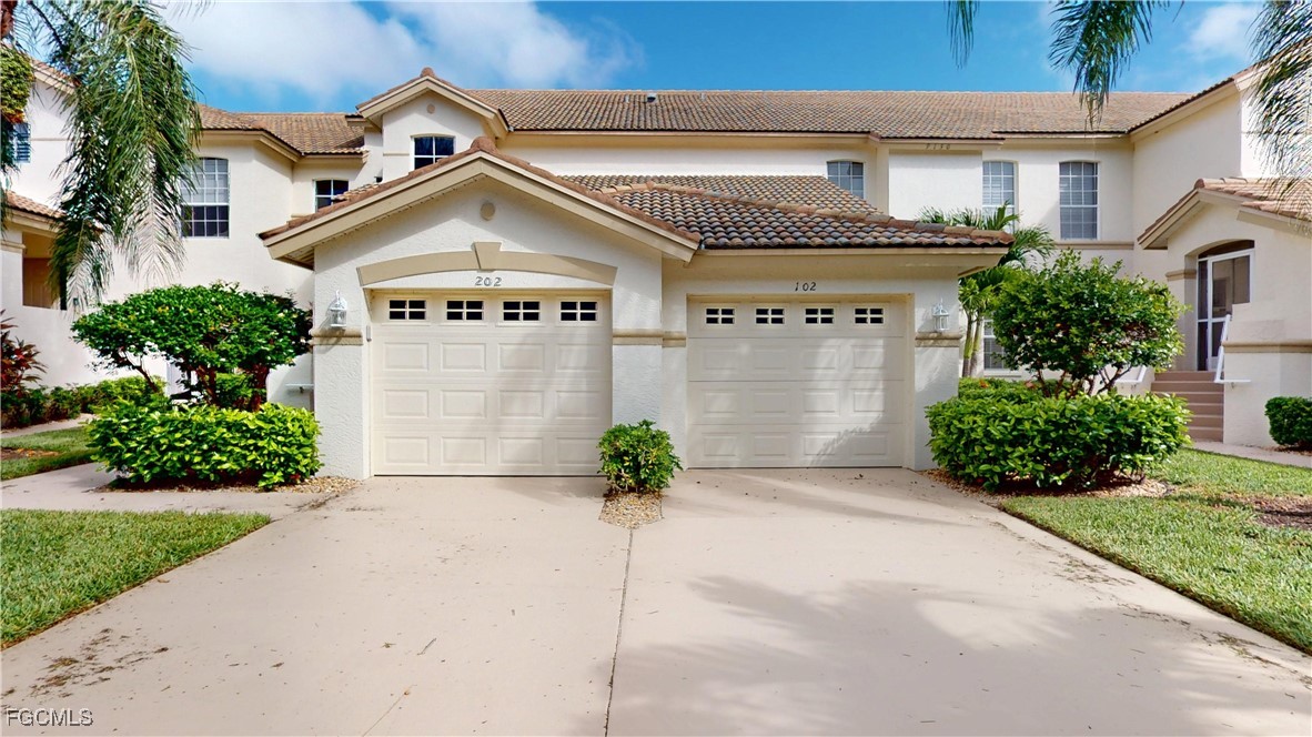 9130 Bayberry Bend, Unit 102 Fort Myers, FL 33908 - Photo 32 of 44 a view of a house with potted plants