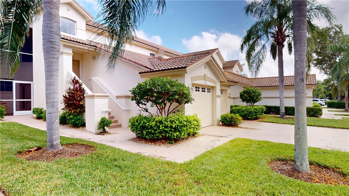 9130 Bayberry Bend, Unit 102 Fort Myers, FL 33908 - Photo 33 of 44 front view of a house with a yard