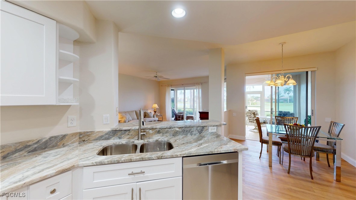 9130 Bayberry Bend, Unit 102 Fort Myers, FL 33908 - Photo 8 of 44 a kitchen with a sink and cabinets