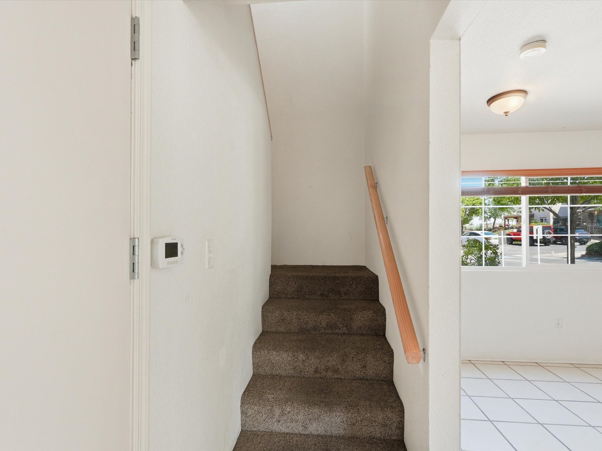 2210 Miguel Chavez Road, Unit 411 Santa Fe, NM 87505 - Photo 18 of 59 The stair going up to the second floor