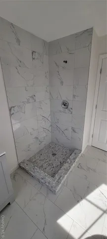 a bathroom with a sink toilet and a window