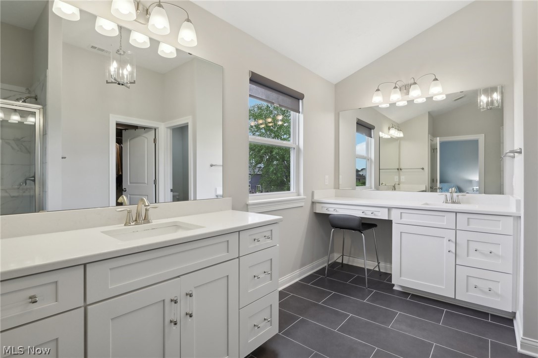 36602 Amalfi Road North Ridgeville, OH 44039 - Photo 32 of 49 Bathroom featuring vanity, tile floors, and lofted ceiling