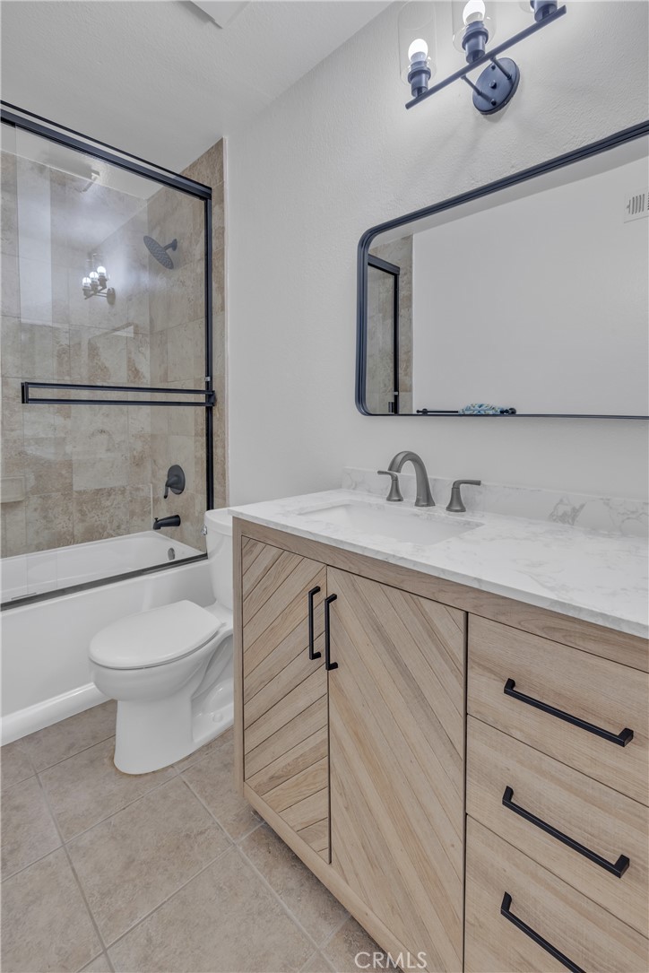 45 Orchard Irvine, CA 92618 - Photo 13 of 29 a bathroom with a toilet a sink and mirror