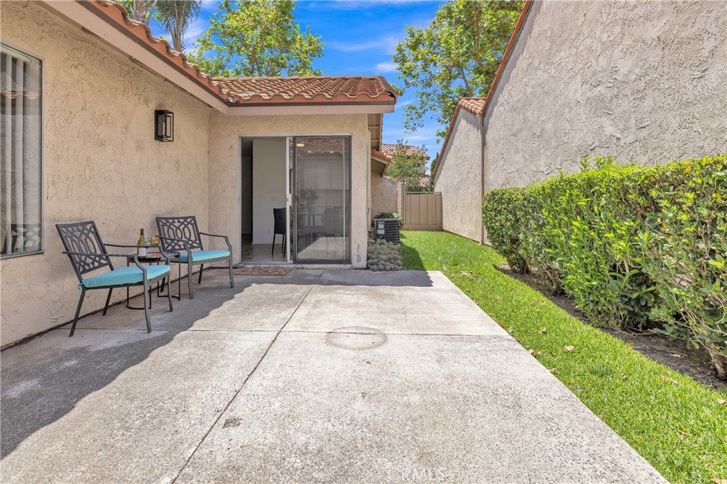 45 Orchard Irvine, CA 92618 - Photo 20 of 29 a view of patio with a table and chairs and potted plants