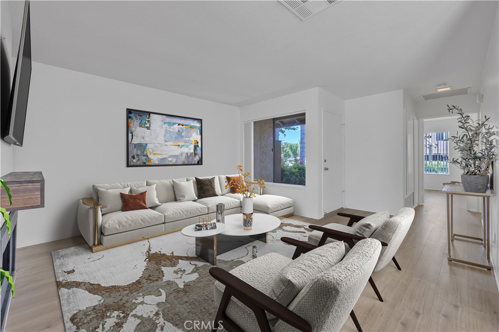45 Orchard Irvine, CA 92618 - Photo 4 of 29 a living room with furniture and wooden floor