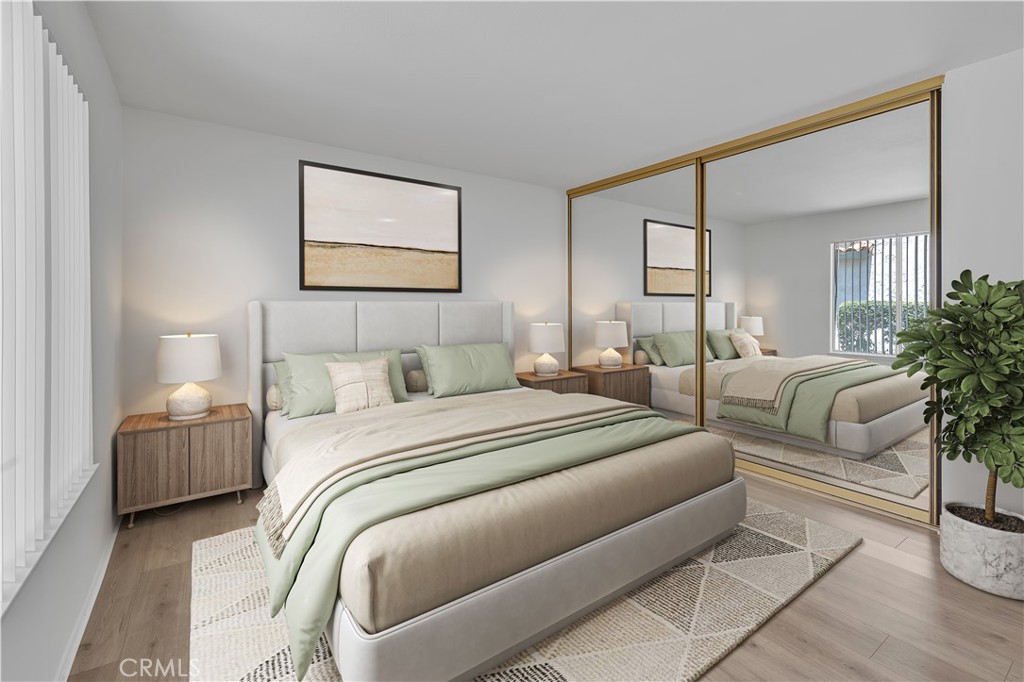 45 Orchard Irvine, CA 92618 - Photo 5 of 29 a bedroom with bed and a potted plant