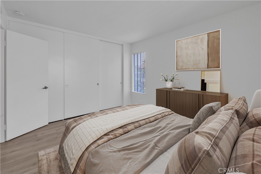 45 Orchard Irvine, CA 92618 - Photo 7 of 29 a bed room with a bed a couch and painting on the wall