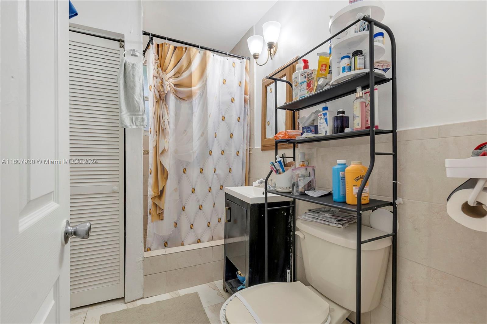 3015 Southwest 103rd Place Miami, FL 33165 - Photo 12 of 32 a bathroom with a sink toilet and shower