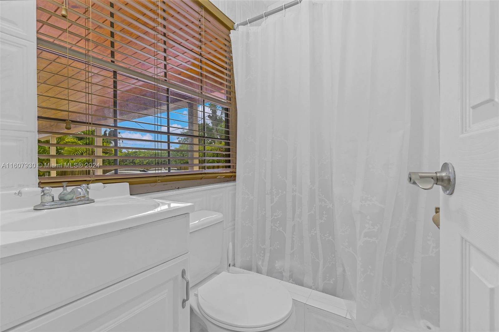 3015 Southwest 103rd Place Miami, FL 33165 - Photo 15 of 32 a bathroom with a sink toilet and shower