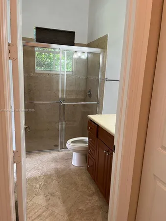 a view of a glass door and a yard