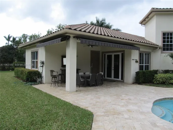 a view of a table and chairs in patio