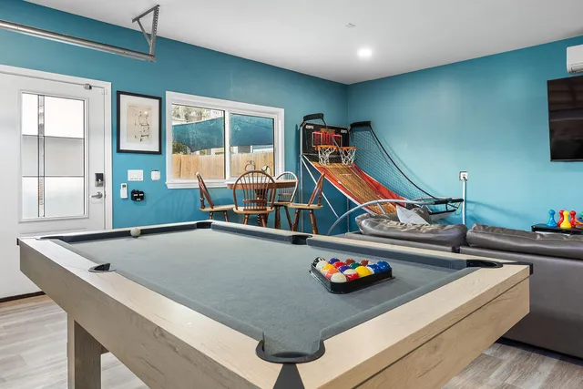a room with furniture and air hockey table