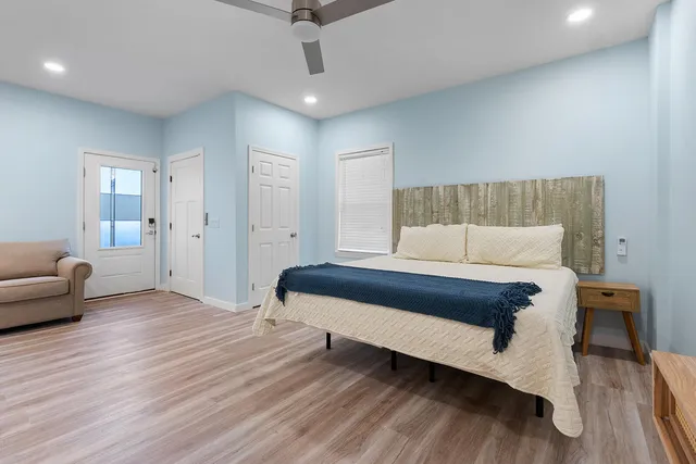 a bedroom with a bed and a couch