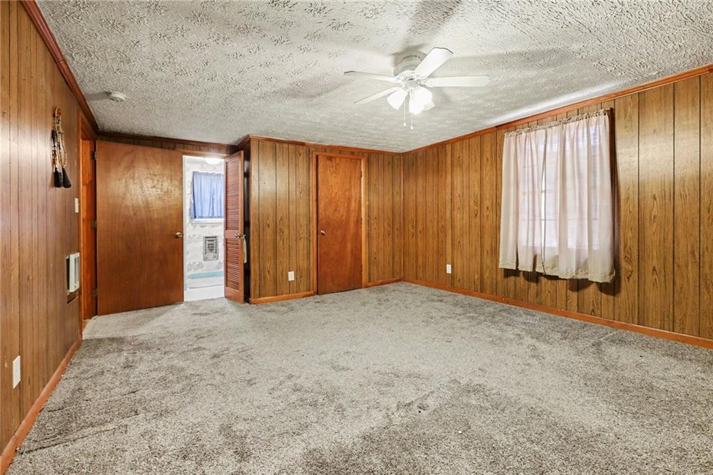 7019 Lake View Lane Doraville, GA 30360 - Photo 21 of 32 an empty room with windows and closet