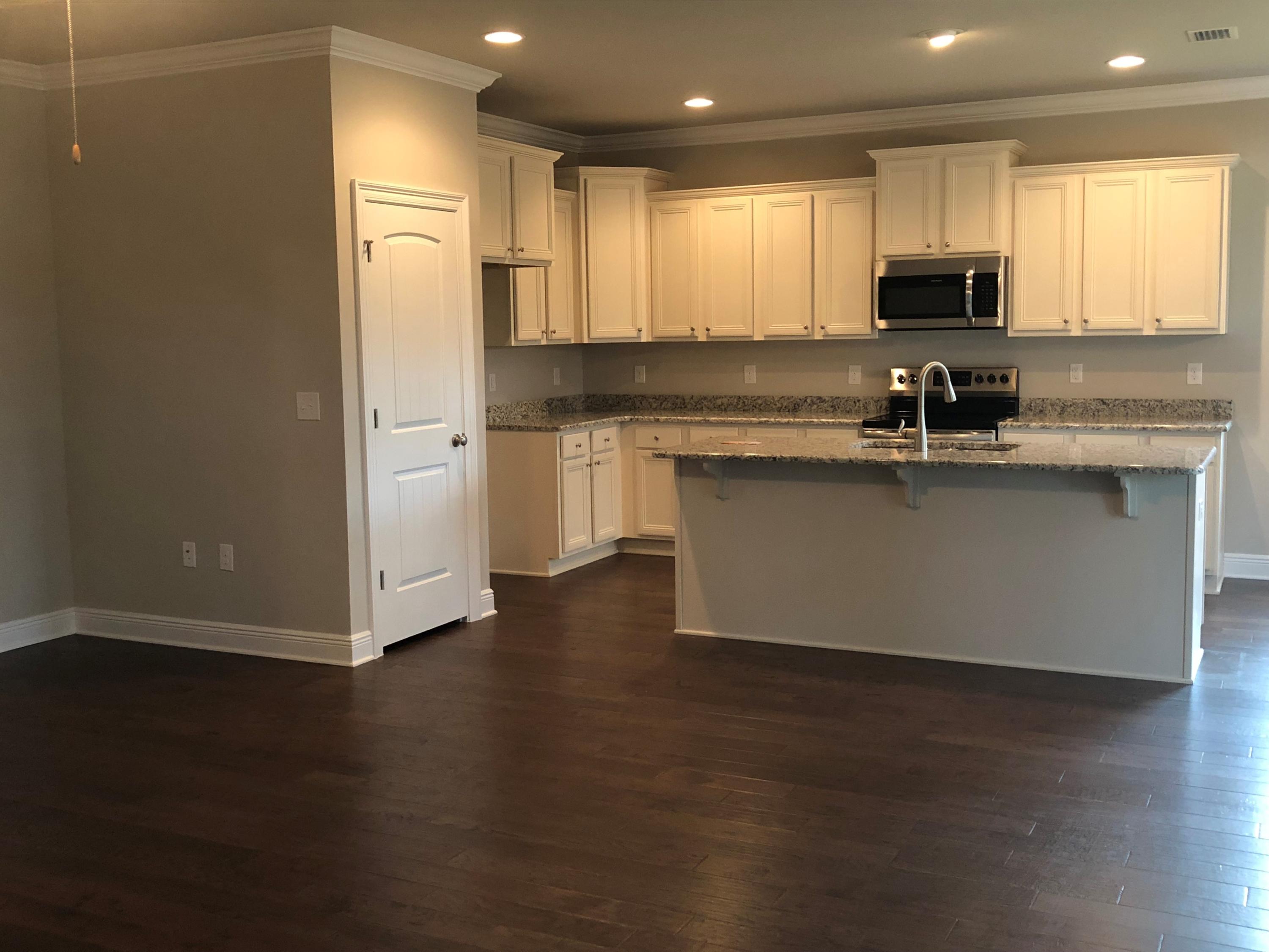 157 Wayne Trail Santa Rosa Beach, FL 32459 - Photo 1 of 17 a kitchen with stainless steel appliances granite countertop a stove a sink and a microwave