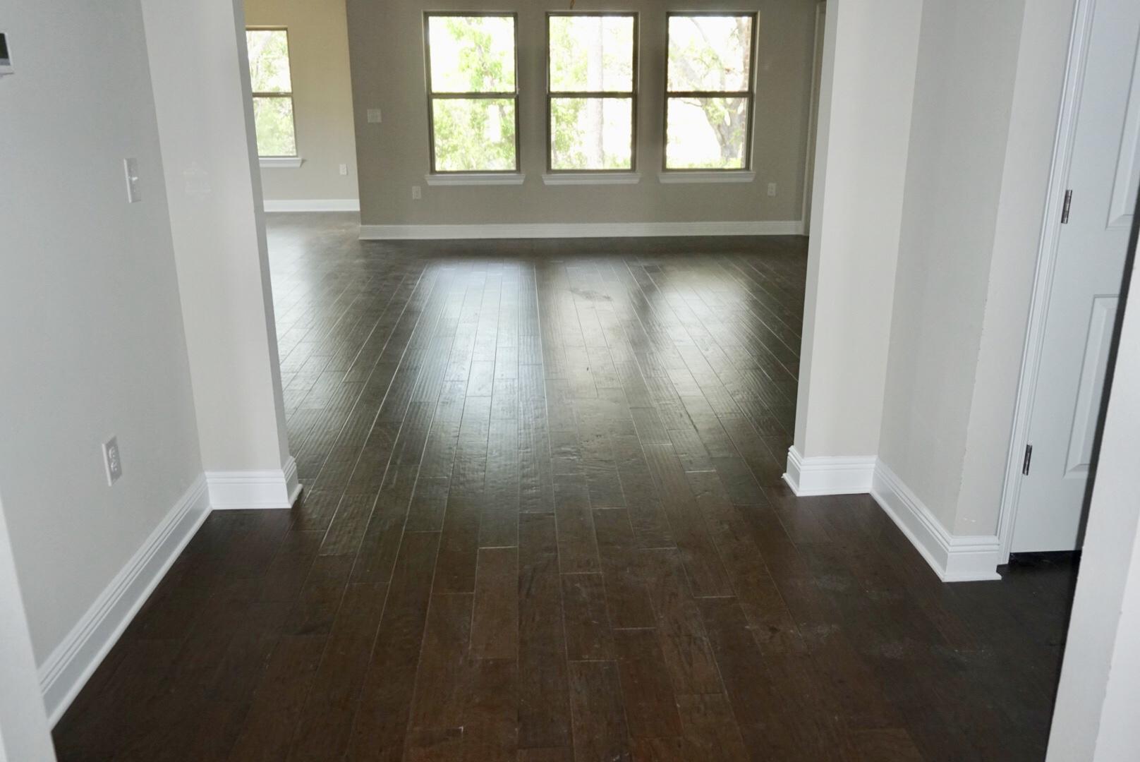 157 Wayne Trail Santa Rosa Beach, FL 32459 - Photo 6 of 17 an empty room with wooden floor and windows