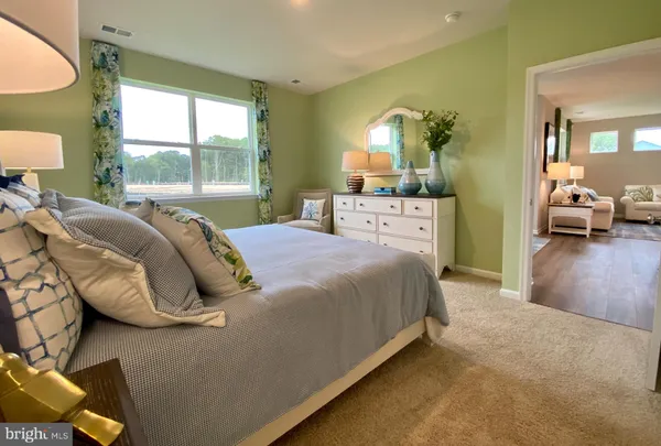 a bed room with a bed and a lamp