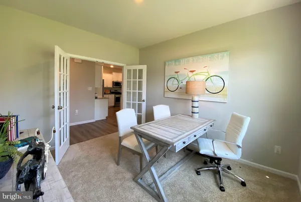 a view of a livingroom with furniture and window