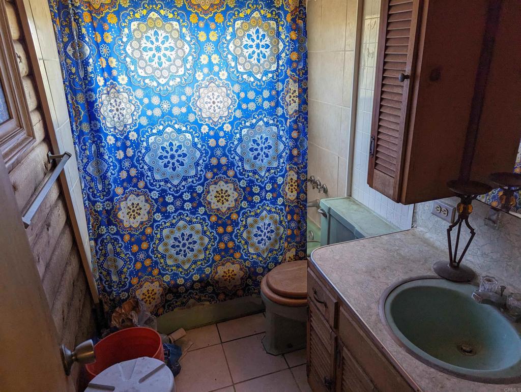 3910 Carveacre Road Alpine, CA 91901 - Photo 11 of 20 a bathroom with a toilet and a sink