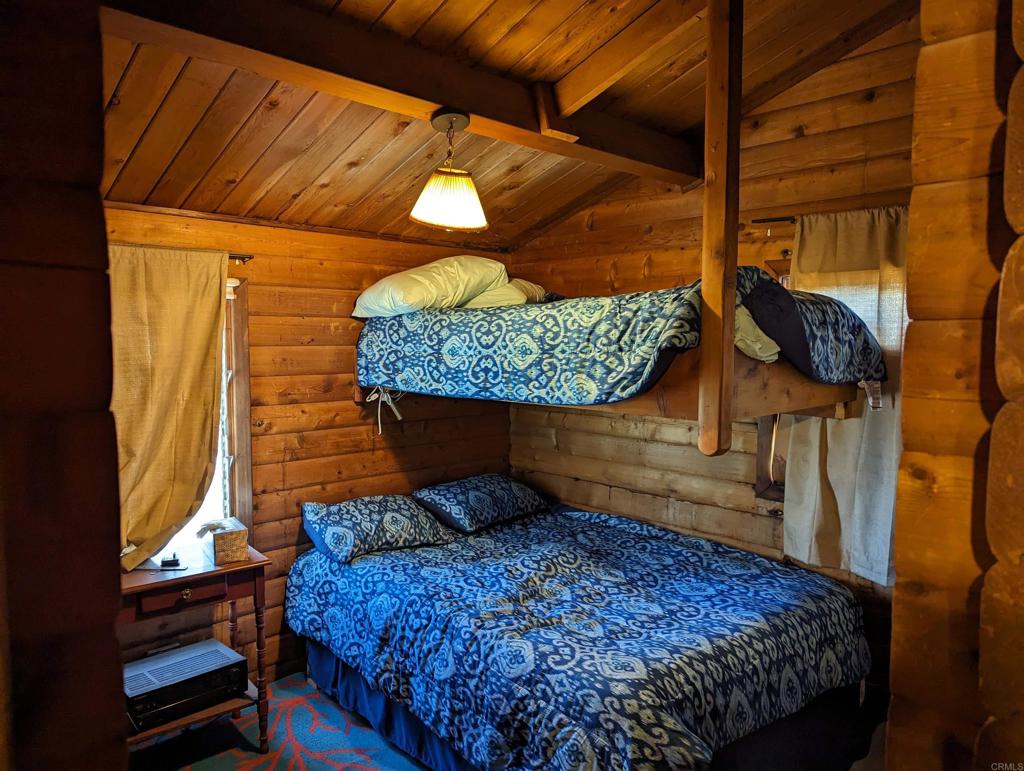 3910 Carveacre Road Alpine, CA 91901 - Photo 13 of 20 a bed sitting in a bedroom next to a window