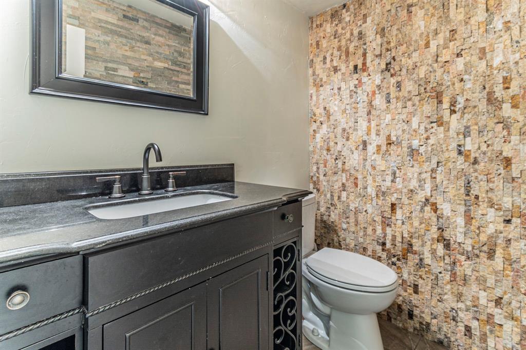 127 Nicklaus Nook Lancaster, TX 75146 - Photo 25 of 37 Half bath with vanity and toilet