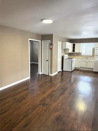 a room with furniture and a wooden floor